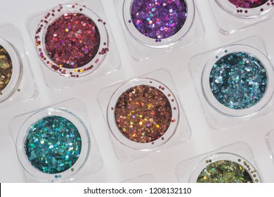 Different colored glitters in transparent jars