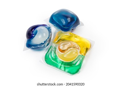 Different Colored Laundry Detergent Capsules On A White Background
