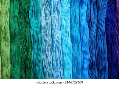 Different colorful embroidery threads as background, top view - Powered by Shutterstock