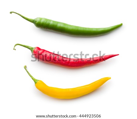 Different colors chilli peppers isolated on white background.