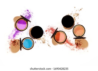 Different colours of eye shadow compact cosmetic make up at 45 degree angle isolated on white background with harsh shadows