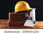 Different construction material and tools on wooden table