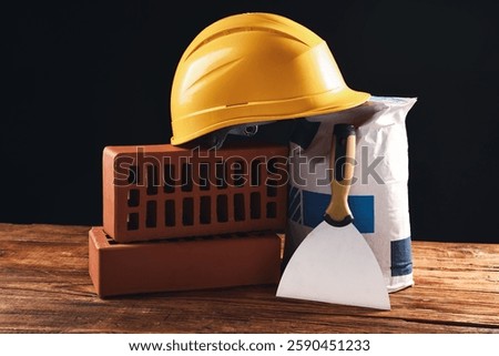 Different construction material and tools on wooden table