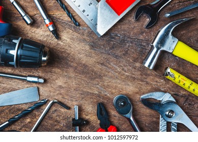 Different construction tools with Hand tools for home renovation on wooden board maintenance and reparing concept. - Shutterstock ID 1012597972