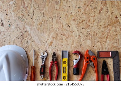 Different construction tools with Hand tools for home renovation on wooden board maintenance and reparing concept.