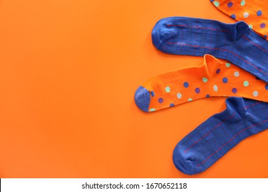 Different Cotton Socks On Color Background