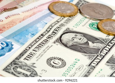 Different countries bank notes with gold coins