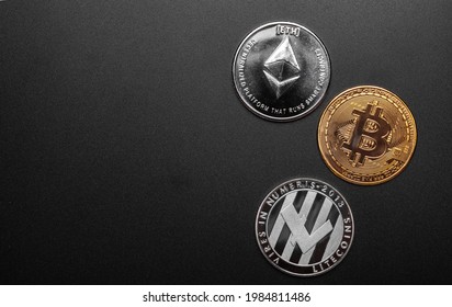 different cryptocurrencies coins btc, ltc and eth isolated on black background, copy space left