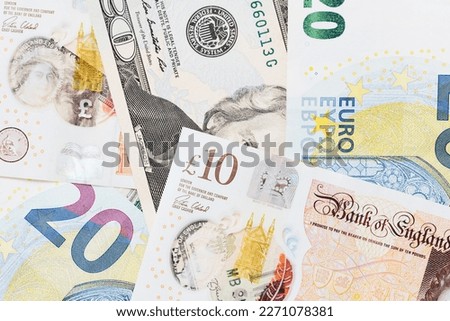Different currency banquetes background. Various currency texture. USA american dollar. Twenty euro blue bill. Great Britain Pound cash background. Pile of cash pattern.