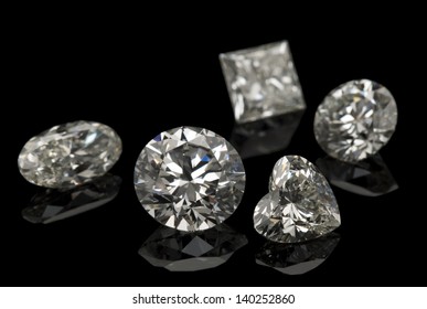 Different cuts of diamond isolated on black background.