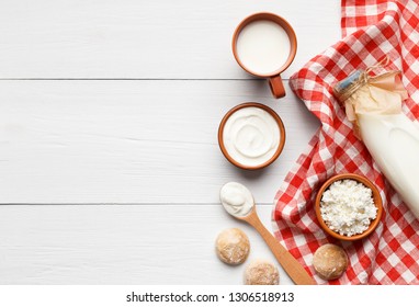 Different Dairy Products On White Wooden Background, Top View, Copy Space, Mockup. Homemade Bakery Recipe Concept