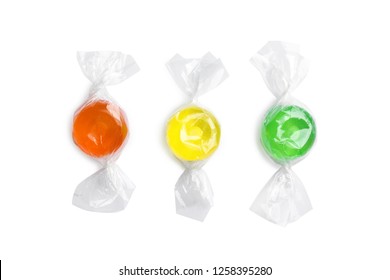 Different delicious colorful candies on white background, top view - Powered by Shutterstock