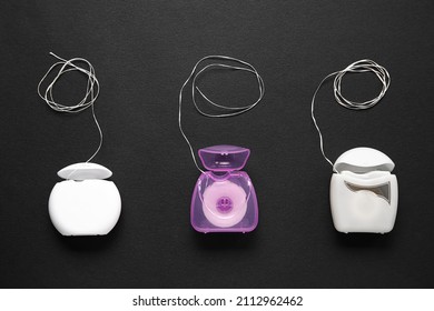 Different dental floss on black background