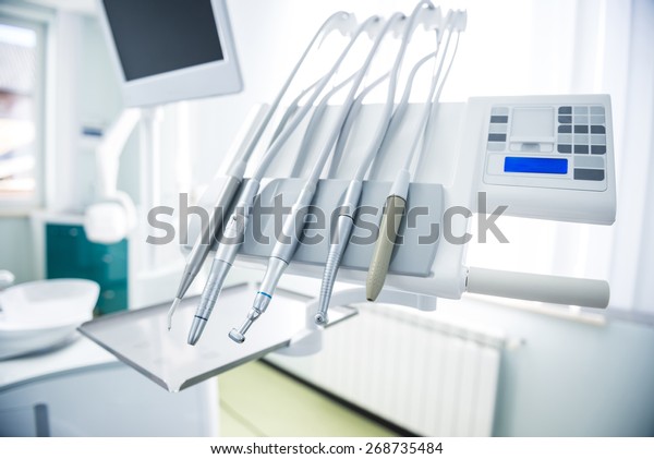 Different dental instruments and tools in a\
dentists office