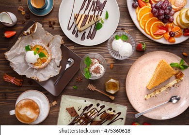 Different desserts with fruits and coffee, top view - Shutterstock ID 475360618