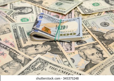 different dollar bills as background - Shutterstock ID 345375248