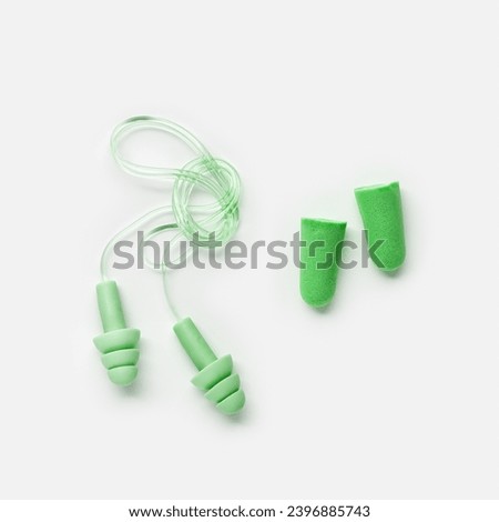 Different earplugs on white background, comfort silicone and rubber ear plug on string protection against noise, protect hear, for swim, sleep, comfort rest. Top view flat lay photo, design object