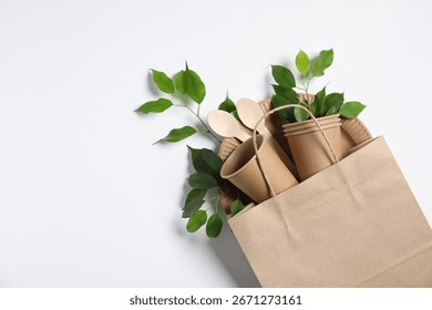 Different eco friendly packaging, tableware and leaves on white background, flat lay. Space for text - Powered by Shutterstock - Get 15% off with code: PIKWIZARD15