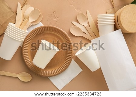 Different Eco tableware on beige background