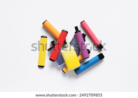 Different electronic cigarettes on white background