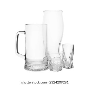 Different elegant empty glasses isolated on white