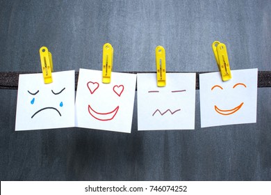 Different emotions drawn on notes, dark background.  - Shutterstock ID 746074252