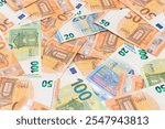 Different Euro Banknotes Money Background. Euro Money Currency. Colored Paper Money. A Lot of Fifty Euro Bills. Business, Finances, Cash and Money Saving Concept