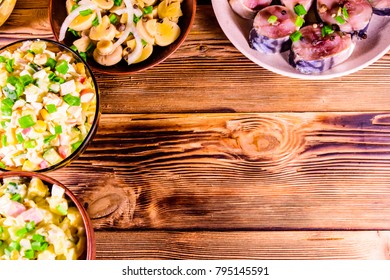 Different festive dishes on rustic wooden table. Top view