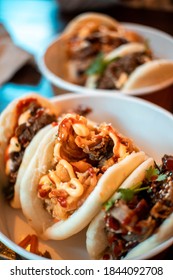Different filling meat and veggie vegetarian bao buns in fluffy Traditional Chinese steamed buns bread, thai asian savory sandwich meal