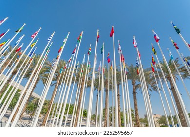Different flags of many countries on sky background. Bottom view. the concept of international cooperation.