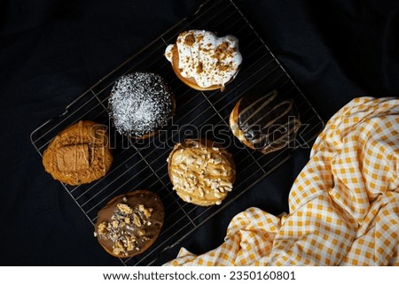 Similar – top view of assorted fresh tasty muffins