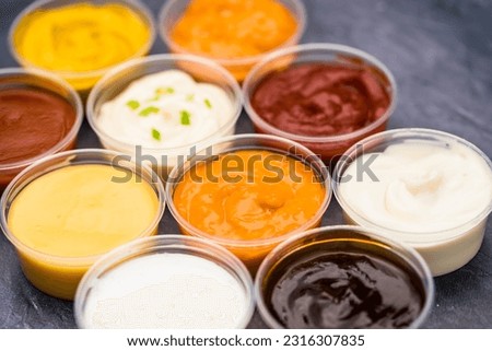 Different flavored sauces next to each other.
