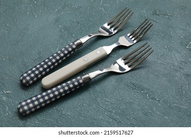 Different Forks On Grey Background