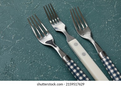 Different Forks On Grey Background, Closeup