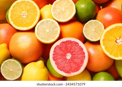 Different fresh citrus fruits as background, top view - Powered by Shutterstock