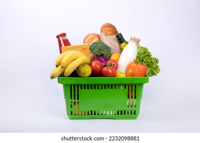 Different fresh vegetables for eating healthy. Fresh vegetables in basket isolated on white backgroun
