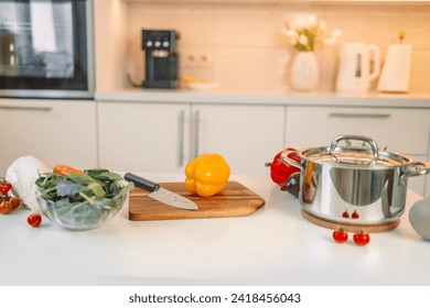 Different fresh vegetables on white table in modern kitchen. Space for text: High quality photo - Powered by Shutterstock