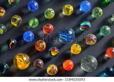Different glass balls on black background