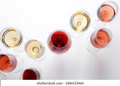 Different Glasses With Wine On White Background, Top View