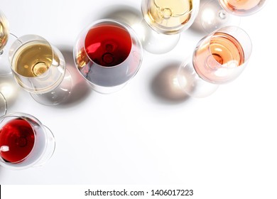 Different Glasses With Wine On White Background, Top View