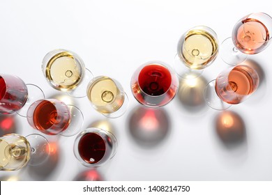 Different Glasses With Wine On White Background, Top View