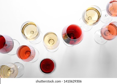 Different Glasses With Wine On White Background, Top View