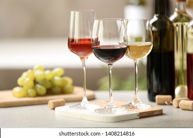 Different glasses with wine served on table