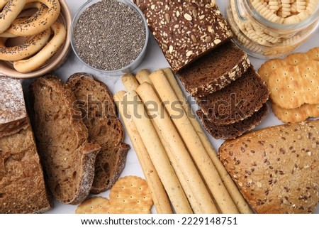 Different gluten free products on white background, flat lay