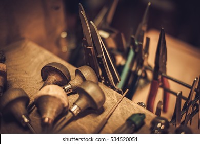 Different goldsmiths tools on the jewellery workplace - Shutterstock ID 534520051