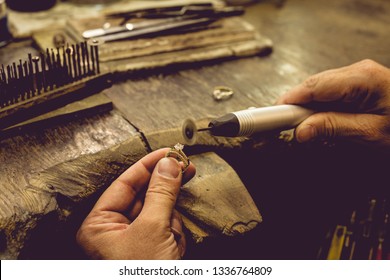 Different goldsmiths tools on the jewelry workplace. Jeweler at work in jewelry