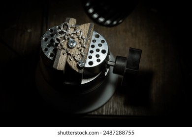 Different goldsmiths tools on the jewelry workplace. Jeweler at work in jewelry. Desktop for craft jewelry making with professional tools. Close up view of tools. - Powered by Shutterstock