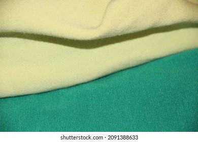 Different Green Fabric. Folds On The Fabric. Backgrounds