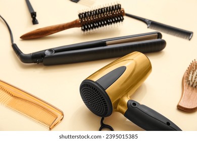 Different hairdressing tools on beige background - Powered by Shutterstock