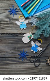 Different Handmade Christmas Toys From Felt With Your Own Hands On Wooden Background. New Years Childrens DIY Concept. Xmas Tree Decoration, Gift Or Greeting Card.